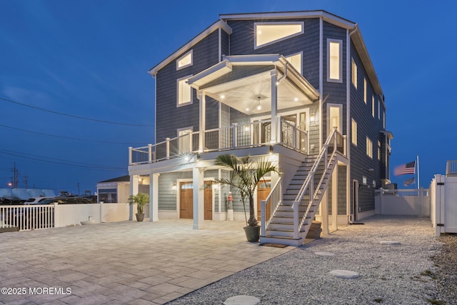 107 Bay Shore Dr, Toms River, NJ 08753 - view of front of home with fence, stairs, a balcony, a patio, and driveway
