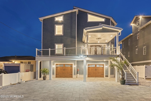 107 Bay Shore Dr, Toms River, NJ 08753 - view of front of house with decorative driveway, a garage, fence, and a balcony