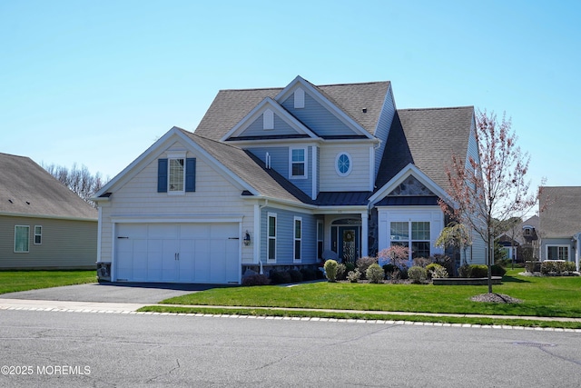 craftsman inspired home with a shingled roof, driveway, a front lawn, and a garage