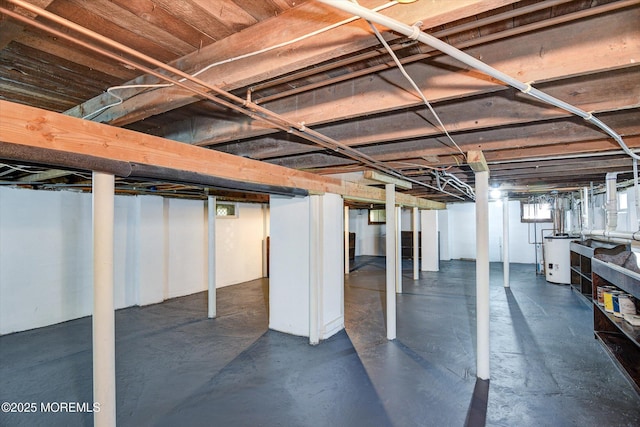 below grade area featuring water heater