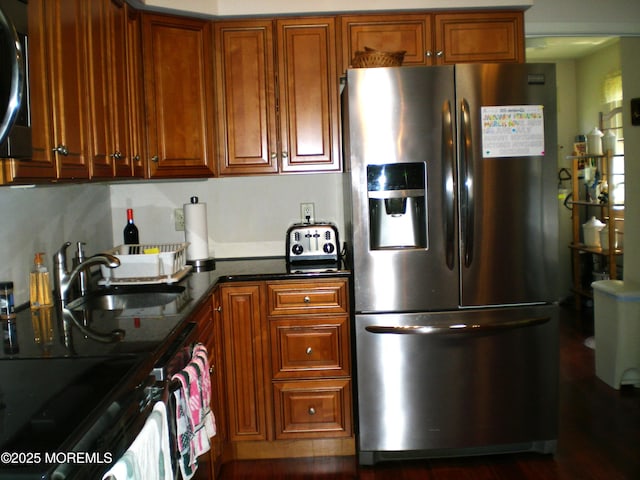 24 Dartmouth St Unit 61, Whiting, NJ 08759 - kitchen featuring brown cabinets, appliances with stainless steel finishes, and a sink