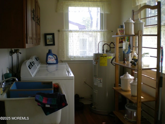 24 Dartmouth St Unit 61, Whiting, NJ 08759 - clothes washing area with cabinet space, a wealth of natural light, washing machine and clothes dryer, and electric water heater