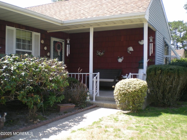 24 Dartmouth St Unit 61, Whiting, NJ 08759 - doorway to property featuring a shingled roof and covered porch
