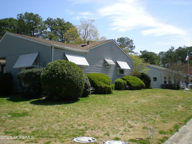 24 Dartmouth St Unit 61, Whiting, NJ 08759 - view of side of home featuring a yard