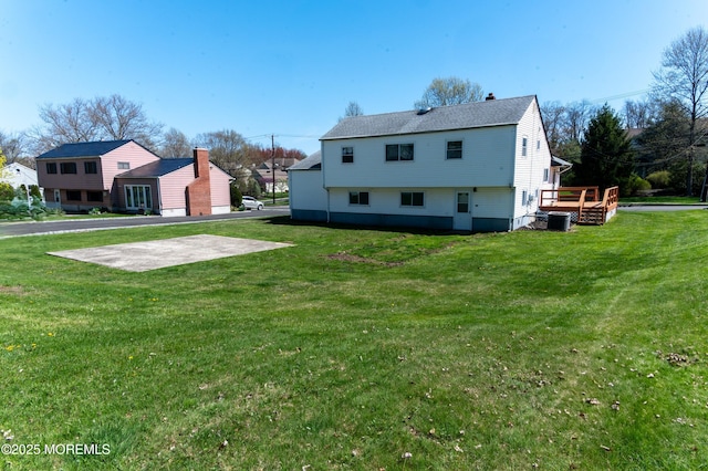 20 Telegraph Hill Rd, Holmdel, NJ 07733 - rear view of house featuring a lawn, a wooden deck, a chimney, and roof with shingles
