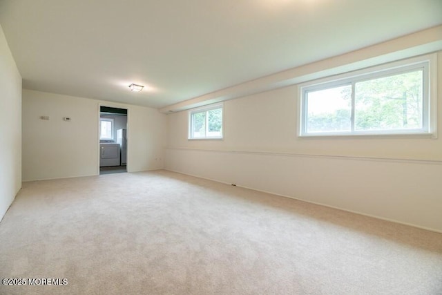 20 Telegraph Hill Rd, Holmdel, NJ 07733 - unfurnished room featuring light carpet and washer / dryer