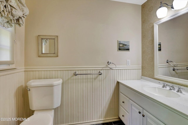 4 Briarcliff Ln, Holmdel, NJ 07733 - half bath with wallpapered walls, a wainscoted wall, toilet, and vanity