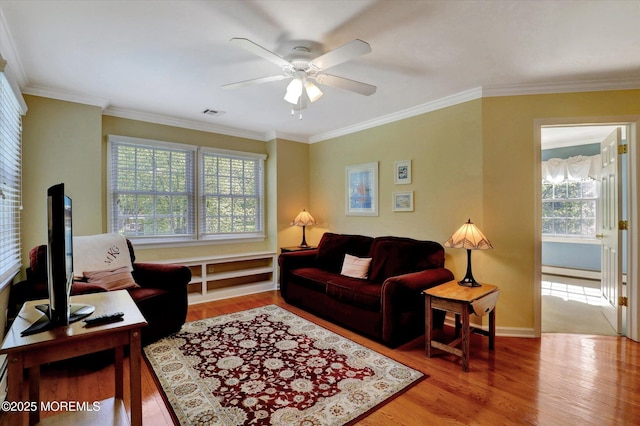 4 Briarcliff Ln, Holmdel, NJ 07733 - living area featuring a baseboard radiator, wood finished floors, ceiling fan, crown molding, and baseboards