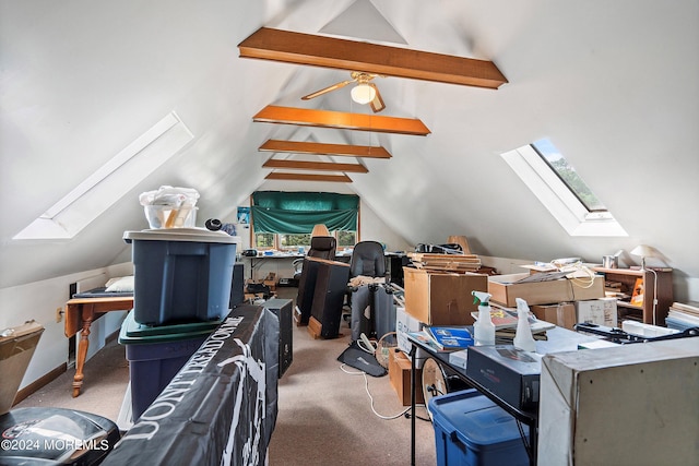 additional living space with carpet floors and vaulted ceiling with skylight