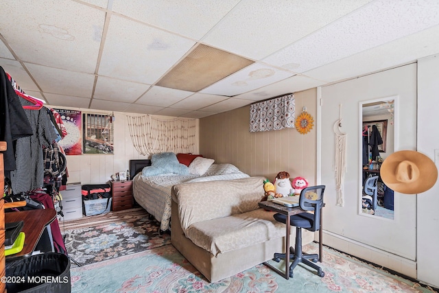 bedroom with a paneled ceiling