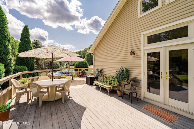 wooden deck with outdoor dining area