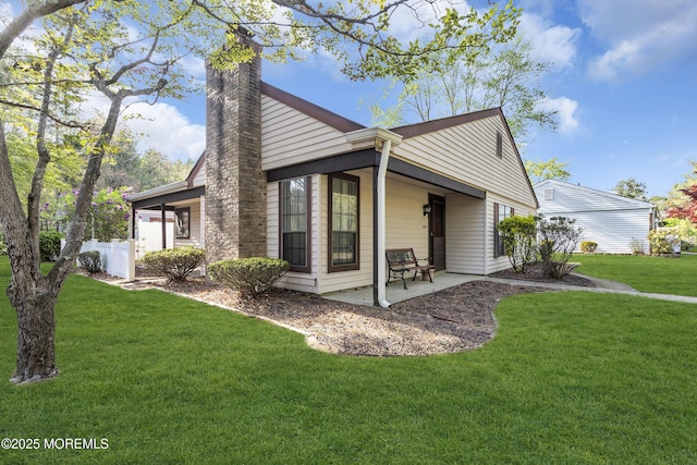 452B Heather Ct, Manchester, NJ 08759 - exterior space with a lawn, a patio area, fence, and a chimney