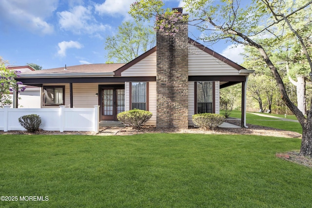 452B Heather Ct, Manchester, NJ 08759 - mid-century inspired home with french doors, a chimney, and a front lawn