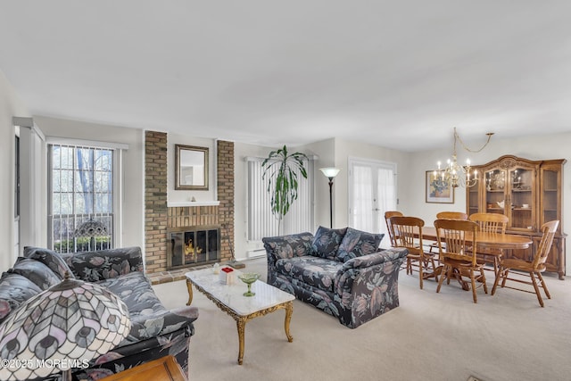 452B Heather Ct, Manchester, NJ 08759 - living room featuring carpet flooring, a chandelier, a brick fireplace, and a healthy amount of sunlight