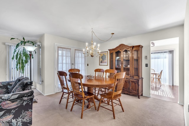 452B Heather Ct, Manchester, NJ 08759 - dining area featuring baseboards, light colored carpet, and a notable chandelier