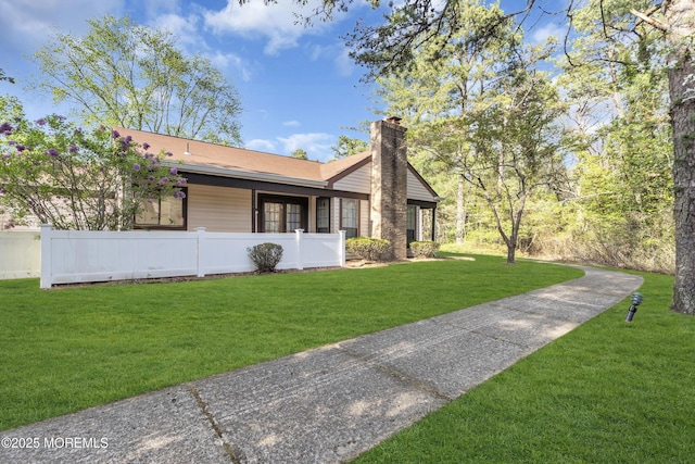452B Heather Ct, Manchester, NJ 08759 - view of side of home with a lawn, fence, and a chimney