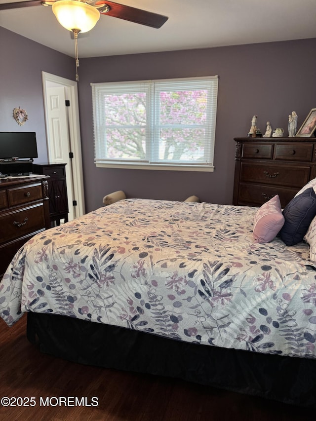 bedroom featuring ceiling fan and wood finished floors