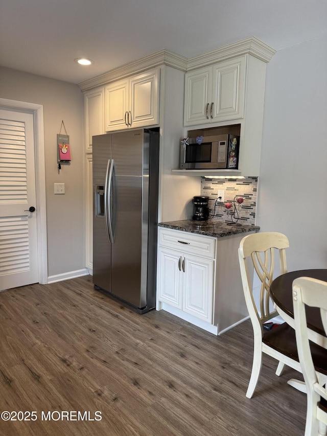 kitchen featuring recessed lighting, decorative backsplash, dark wood-style floors, and stainless steel appliances