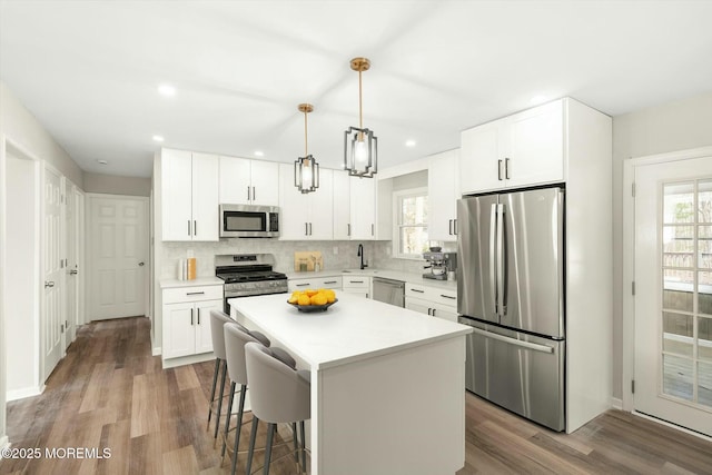 kitchen with a healthy amount of sunlight, stainless steel appliances, and light countertops