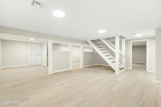 finished basement with recessed lighting, stairway, light wood finished floors, visible vents, and baseboards