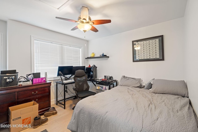 bedroom with wood finished floors and a ceiling fan