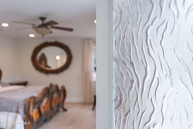 carpeted bedroom featuring recessed lighting and baseboards