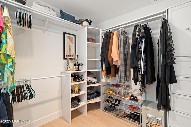 spacious closet featuring wood finished floors