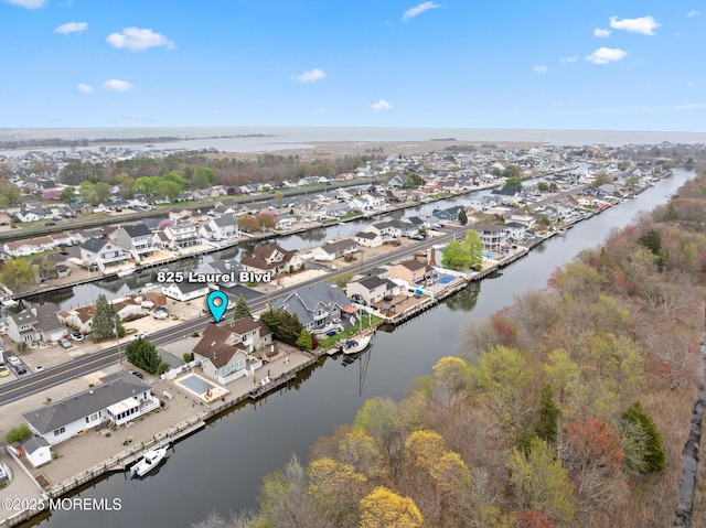 aerial view featuring a residential view and a water view