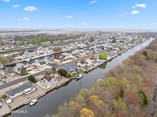 aerial view featuring a residential view and a water view