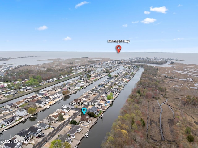 bird's eye view with a residential view and a water view