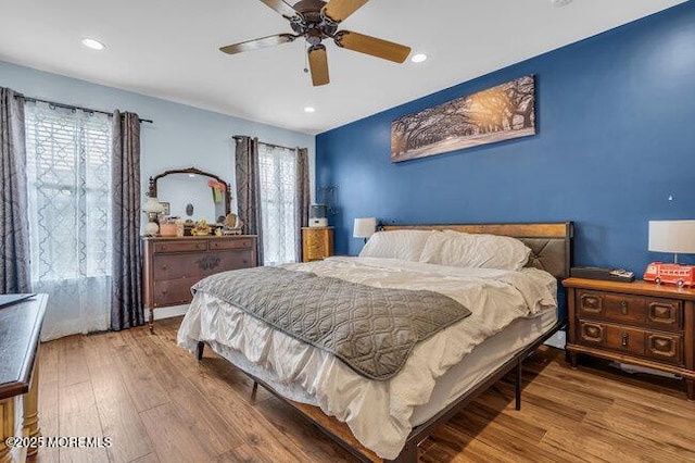 bedroom featuring recessed lighting, a ceiling fan, and wood finished floors