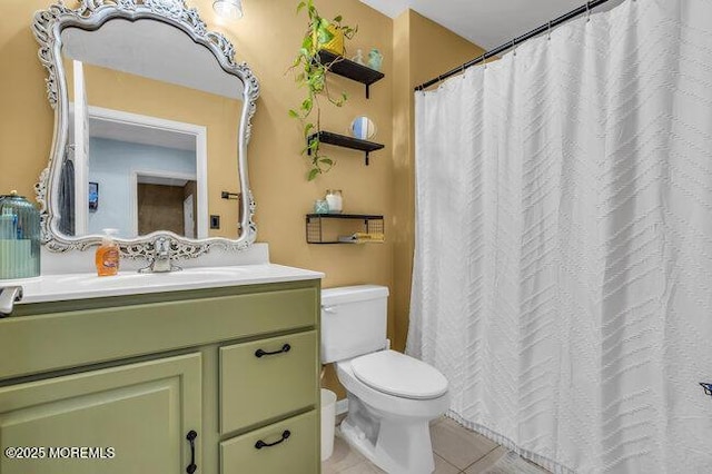 full bathroom with toilet, tile patterned floors, and vanity