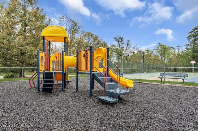 communal playground featuring fence