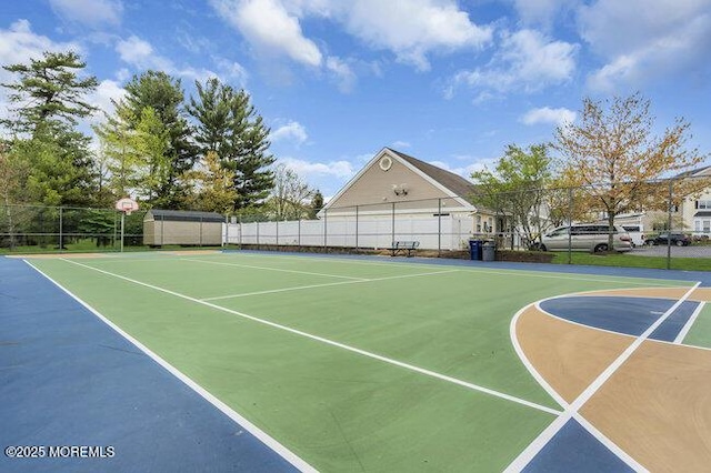 view of sport court featuring fence and community basketball court