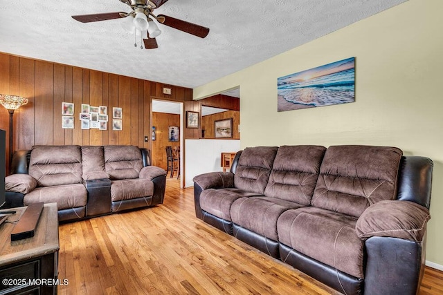 21 Dockage Rd, Bayville, NJ 08721 - living area with a textured ceiling, ceiling fan, wood finished floors, and wooden walls
