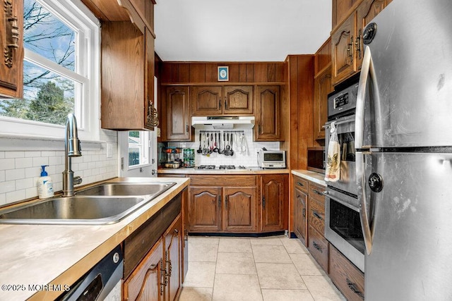21 Dockage Rd, Bayville, NJ 08721 - kitchen with appliances with stainless steel finishes, a sink, tasteful backsplash, and light countertops