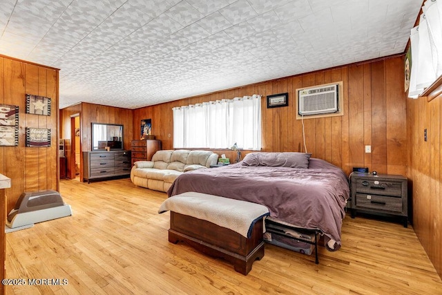 21 Dockage Rd, Bayville, NJ 08721 - bedroom with a wall mounted air conditioner, wooden walls, and light wood-type flooring