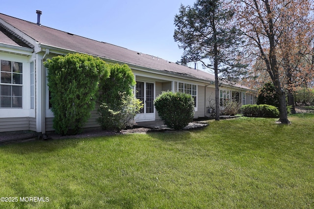 exterior space with a yard