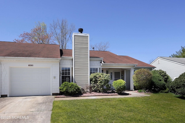 ranch-style home with a front lawn, driveway, a chimney, and a garage