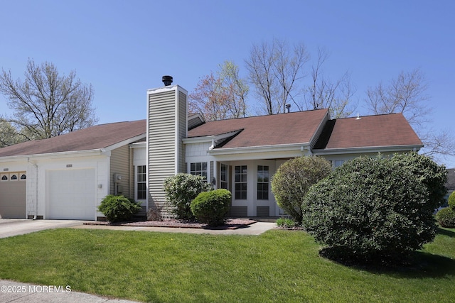 ranch-style house with a chimney, an attached garage, and a front lawn