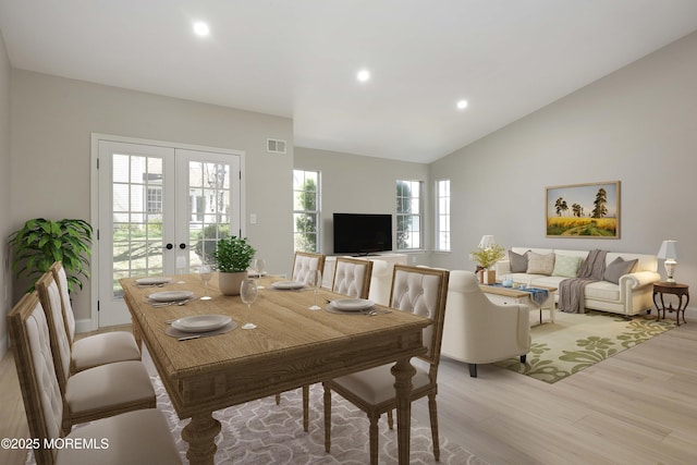 dining space with light wood finished floors, french doors, vaulted ceiling, visible vents, and recessed lighting