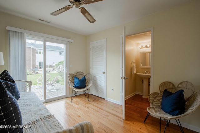 25 Meadow Ave Unit 64, Monmouth Beach, NJ 07750 - sitting room with light wood-type flooring, a ceiling fan, and baseboards