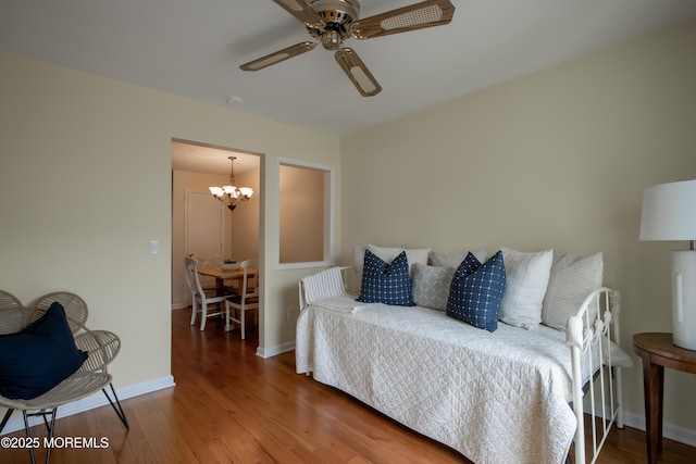 25 Meadow Ave Unit 64, Monmouth Beach, NJ 07750 - bedroom featuring wood finished floors, a chandelier, baseboards, and ceiling fan