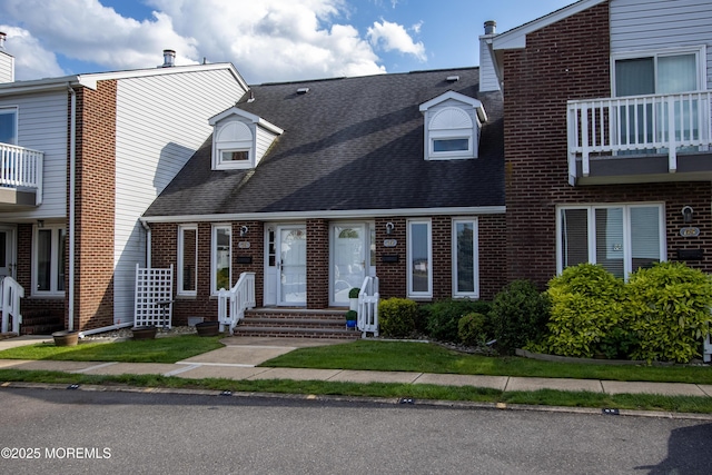 25 Meadow Ave Unit 64, Monmouth Beach, NJ 07750 - view of property with entry steps, brick siding, and roof with shingles