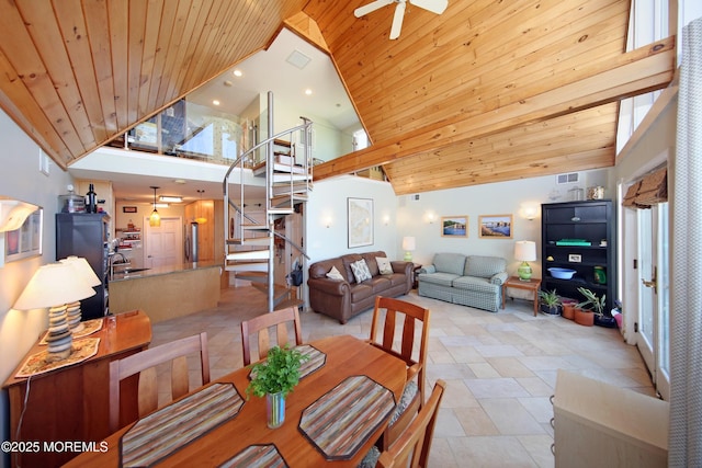 75 Gravelly Point Rd, Highlands, NJ 07732 - dining space featuring ceiling fan, stone finish flooring, visible vents, stairway, and high vaulted ceiling