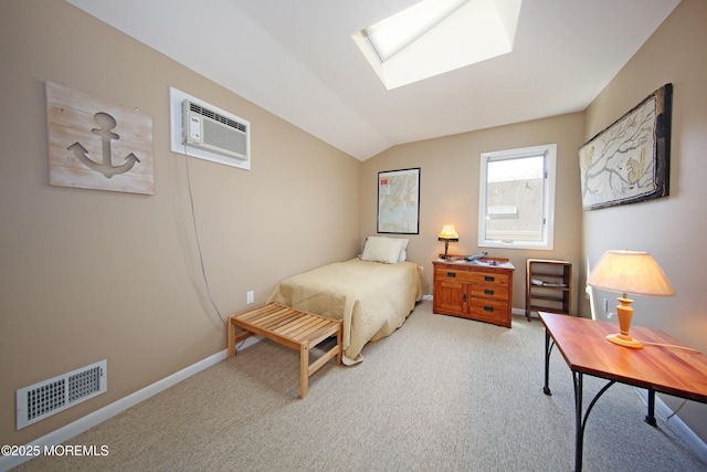 75 Gravelly Point Rd, Highlands, NJ 07732 - bedroom featuring vaulted ceiling with skylight, a wall unit AC, light colored carpet, and visible vents