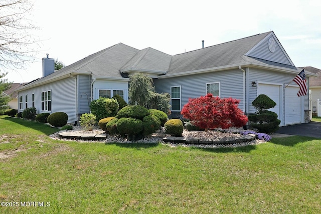 view of property exterior featuring driveway, a chimney, a yard, and a garage