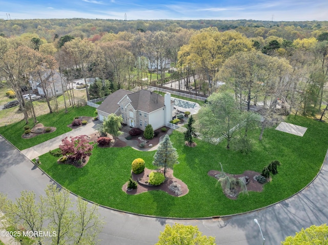 aerial view with a wooded view