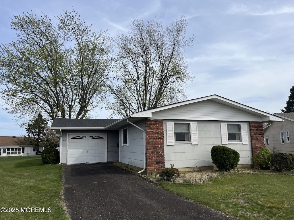 61 Tony Ct, Brick, NJ 08724 - ranch-style house featuring aphalt driveway, a front yard, and a garage
