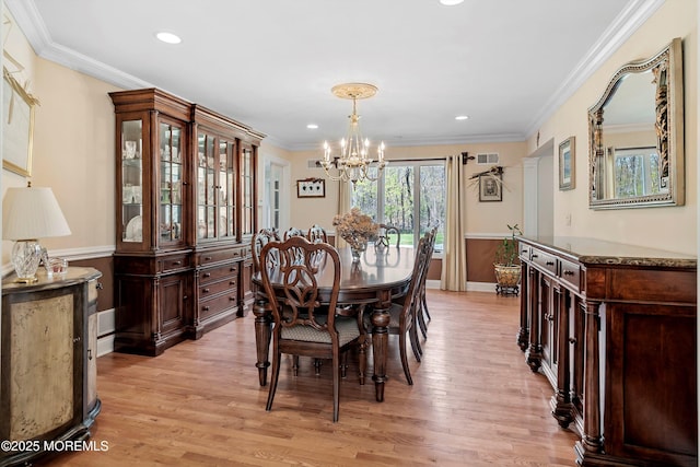dining space with crown molding, a chandelier, light wood-style floors, visible vents, and recessed lighting